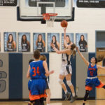 Caitlin Bickle shooting a basket