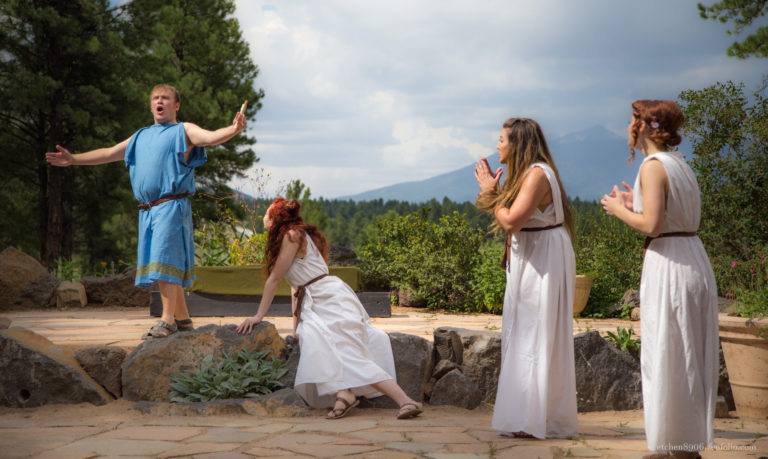 man and two women acting outdoors